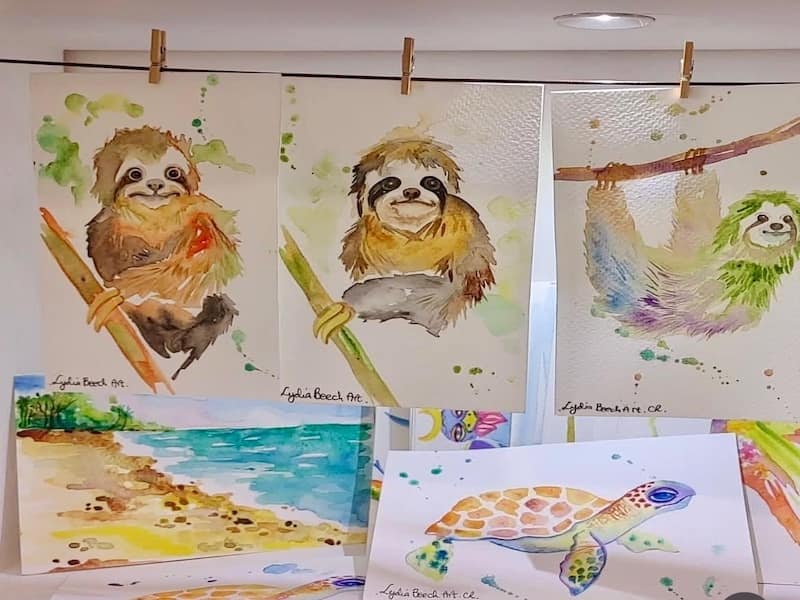 Hand painted sloth posters and cards.