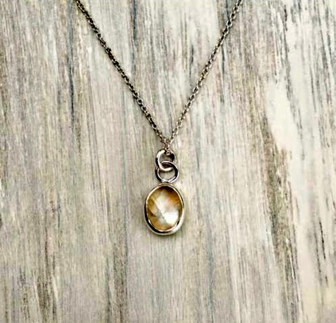 Sterling silver pendent with white stone