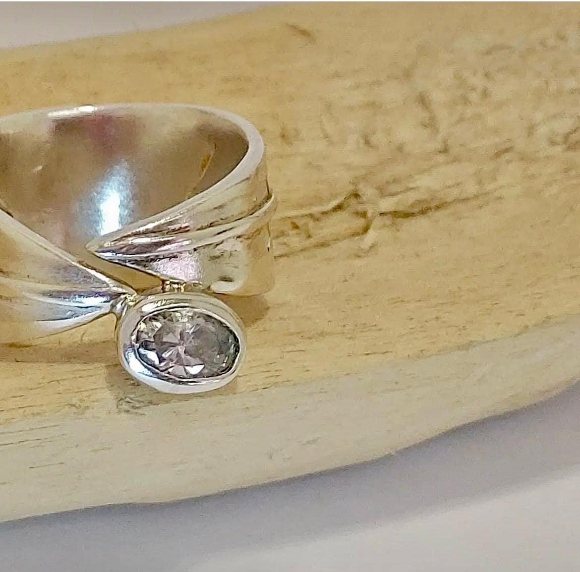 Sterling silver with quartz diamond on wood setting